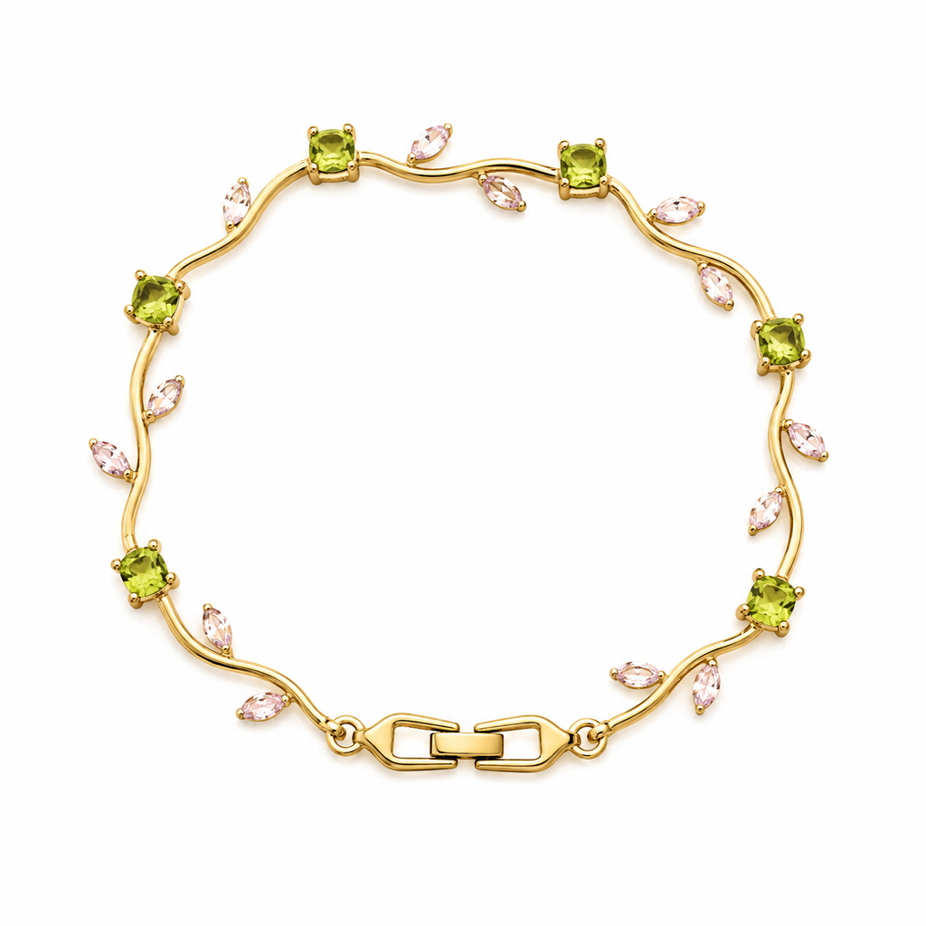 A gold bracelet featuring green peridot gemstones and small pink marquise-cut crystals, arranged in a circular pattern on a white background.