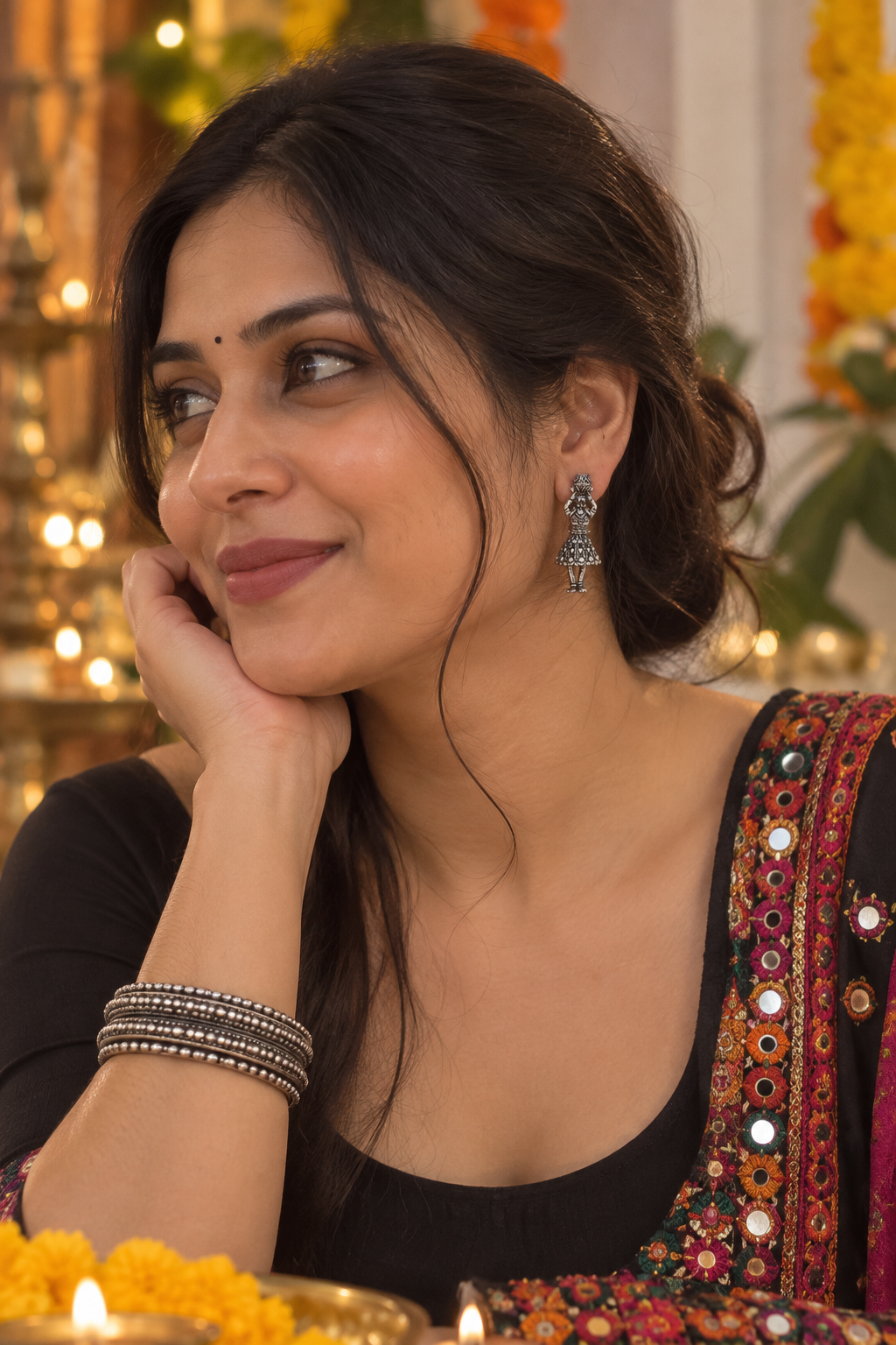 Woman wearing silver oxidized jhumkis