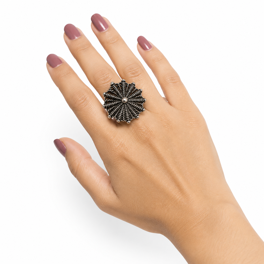 Close-up of Avyaa oxidised silver statement ring on hand